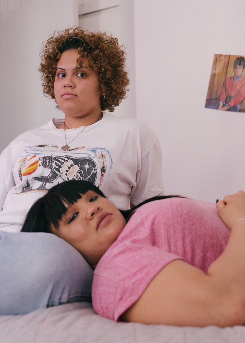 plus size lesbians relaxing in room
