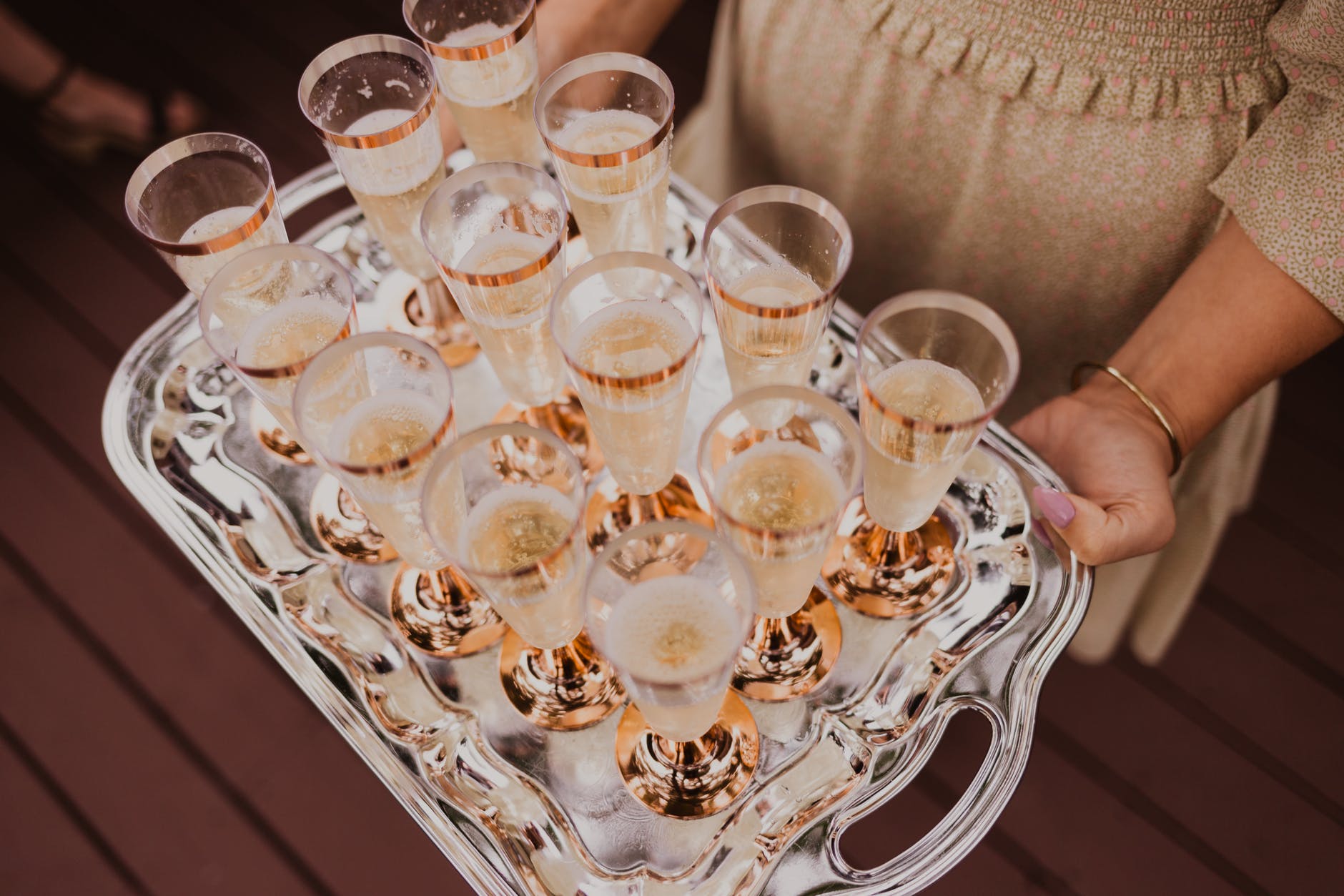 crop woman with tray of drinks