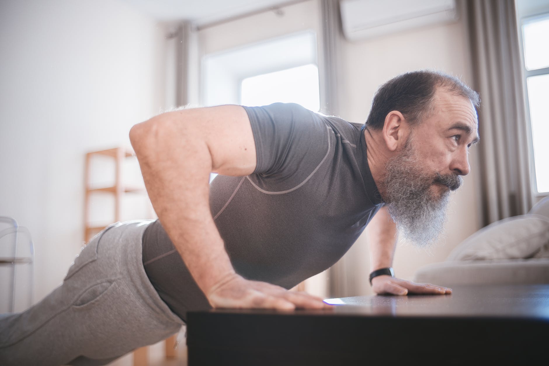 a man doing push up at home