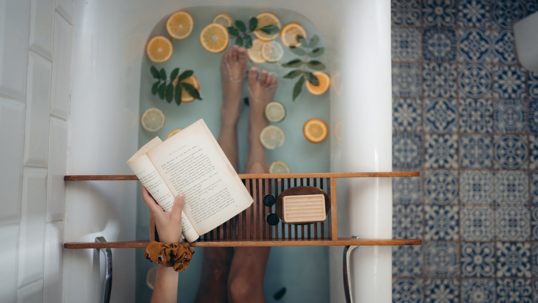 person reading in the bath - perfect Sunday activity