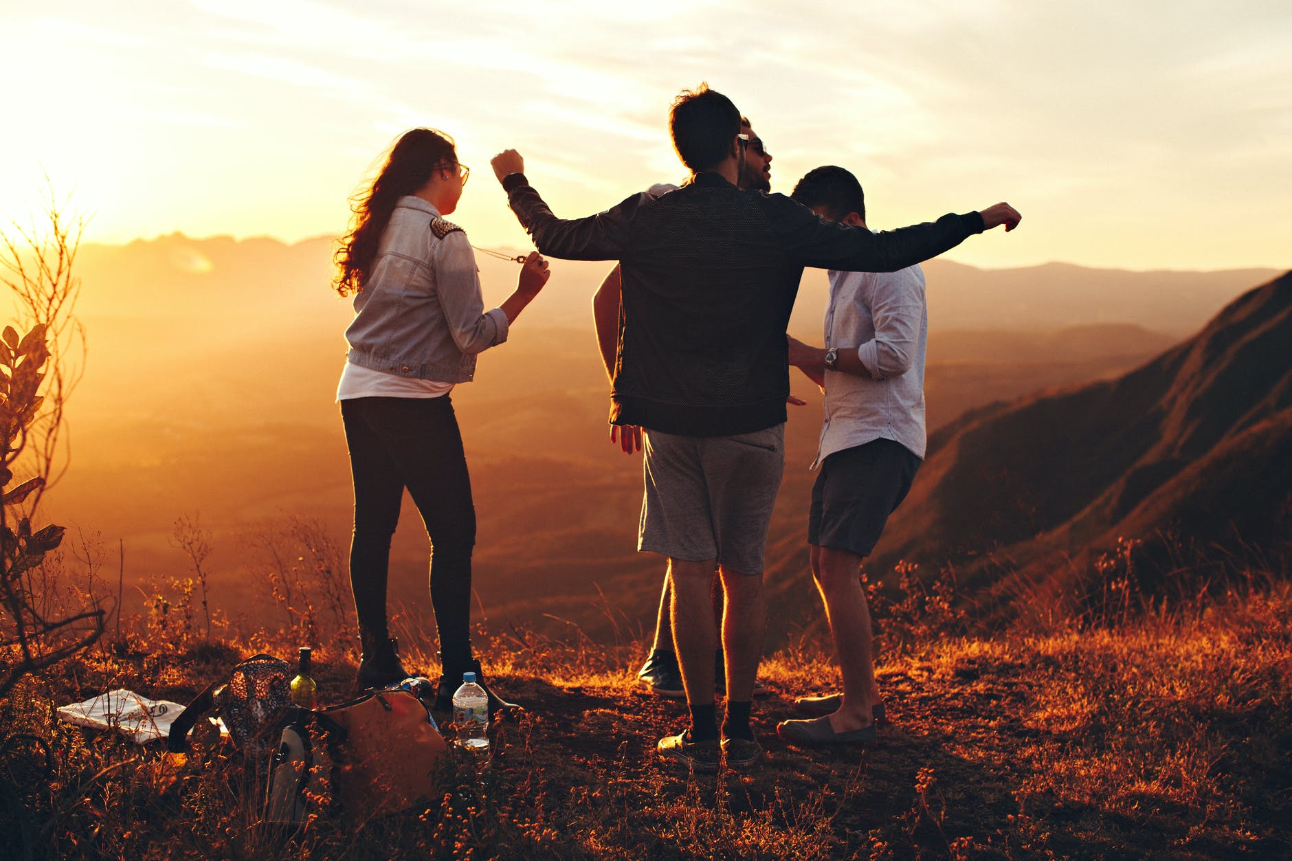 Exercise because you love your body four people standing at top of grassy mountain