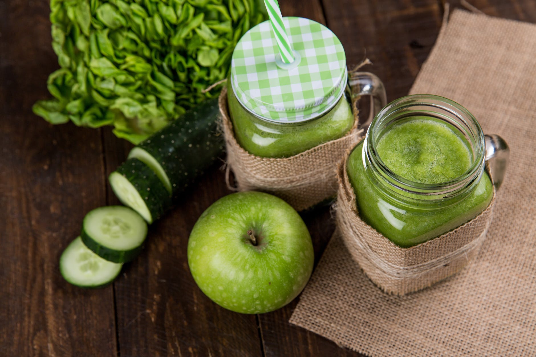 green apple beside of two clear glass jars ways to eat more fruit and vegetables