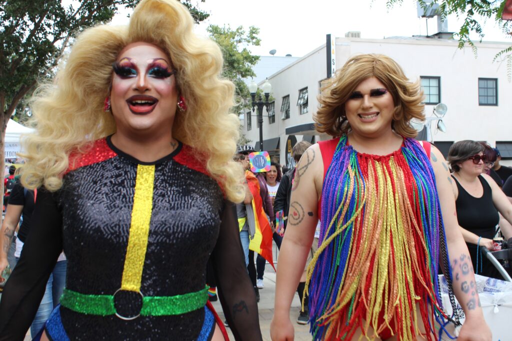 Drag queens walking along the street