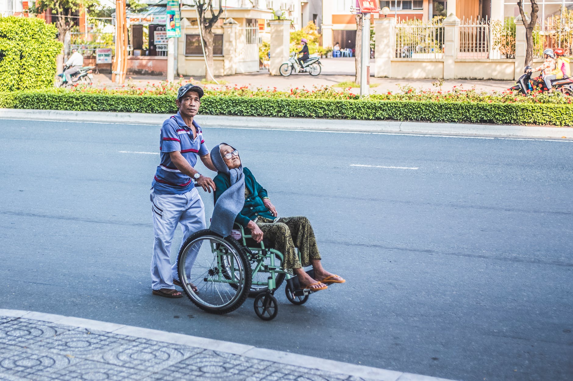 man pushing a woman sitting on wheelchair reasons fat people may be exhausted
