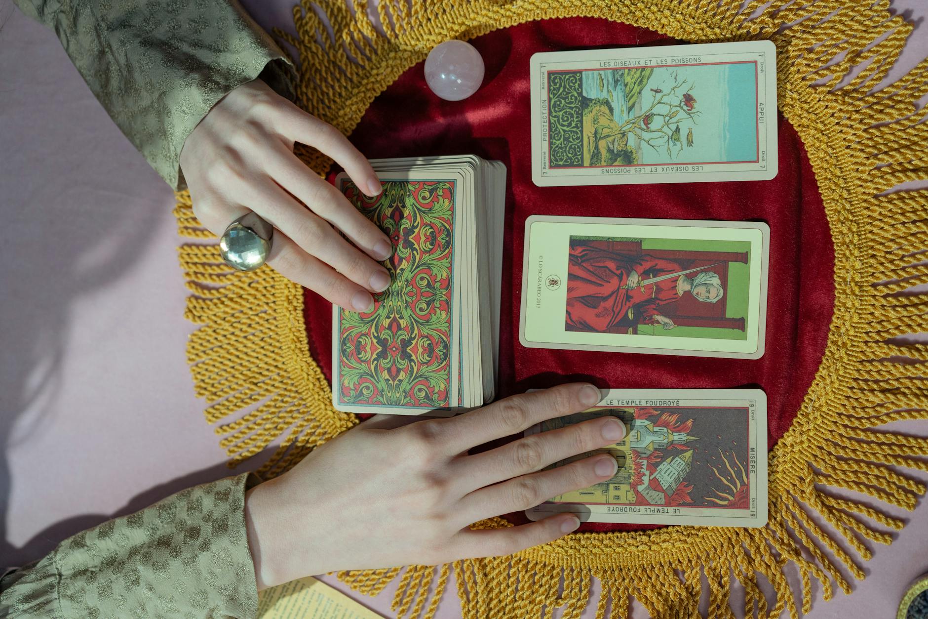 close up shot of a person holding tarot cards