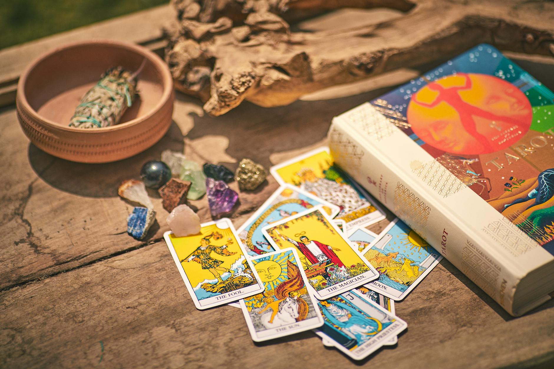 colorful tarot cards and book